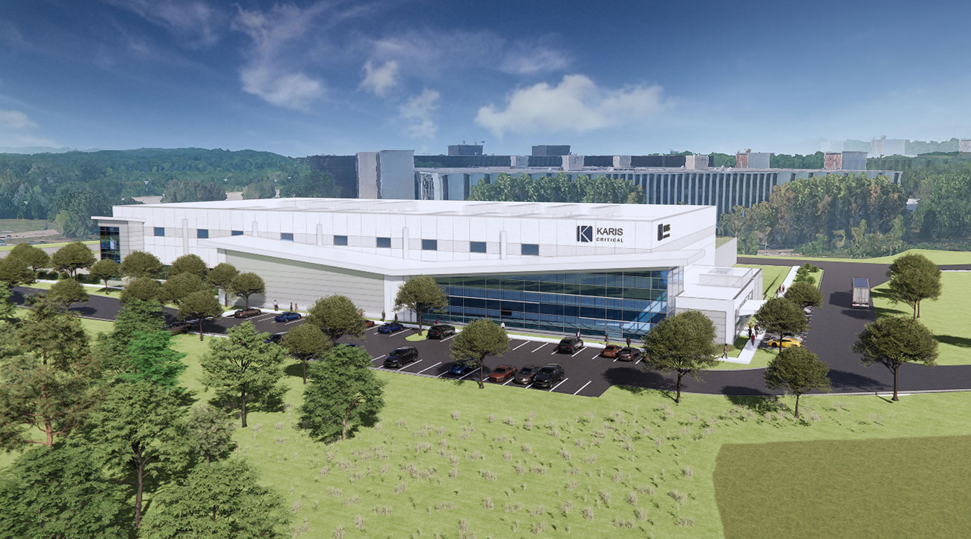 Architectural rendering of a modern Karis Critical Naperville data center facility surrounded by landscaped greenery and adjacent infrastructure, showcasing a sleek, glass-accented design and secure vehicle access.